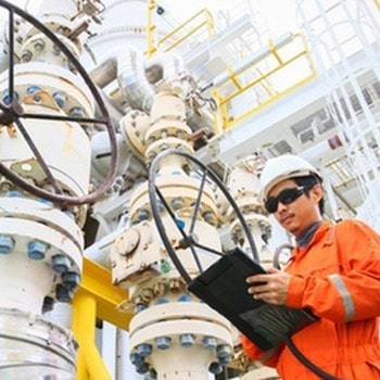 a man in an orange jumpsuit and white helmet