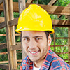 a man wearing a yellow hard hat